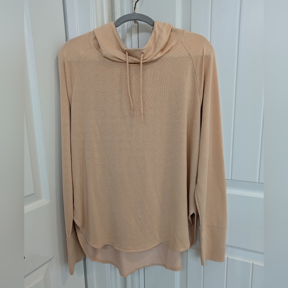 Peach Colored Lightweight Long Sleeved Hoodie With Thumb Holes And Round…